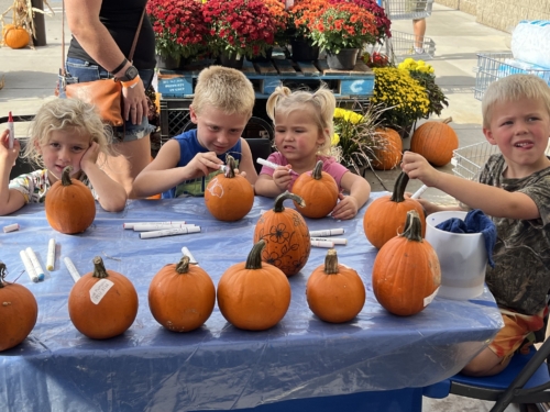 pumpkin painting children painting pumpkins at a local business